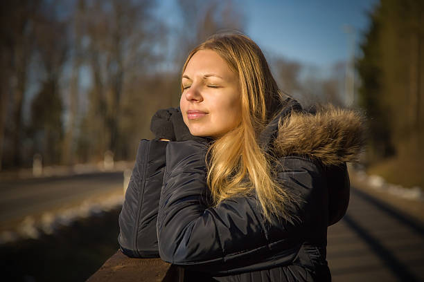 istock Young, beautiful lady in sunny spring and enjoying the sun 512120360