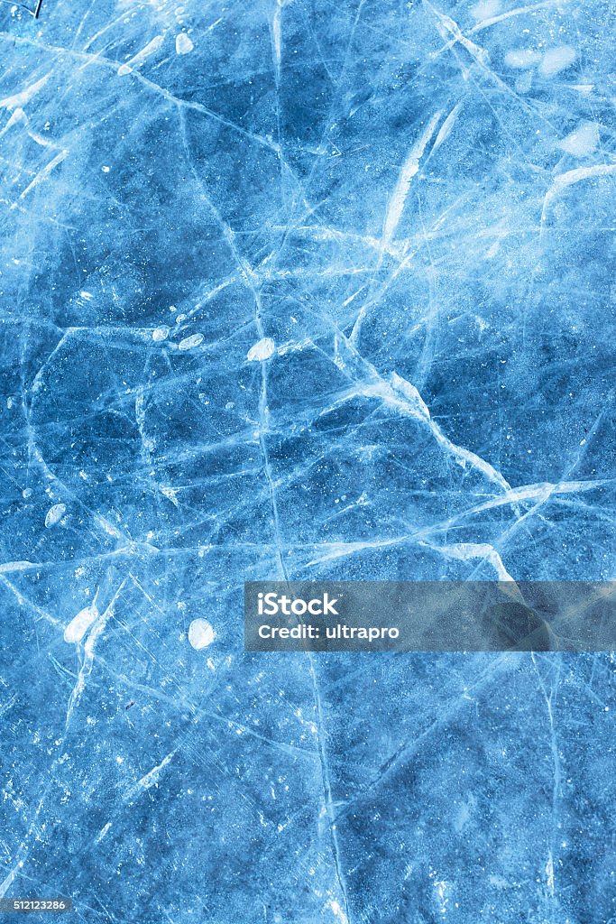 Abstract ice texture with air bubble A network of cracks on a piece of blue ice with air bubble. Ice Stock Photo