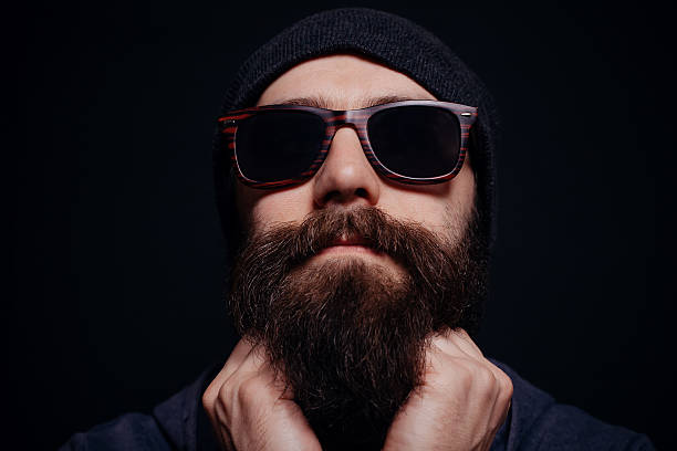 istock Handsome male big beard in glasses and hat 512123674