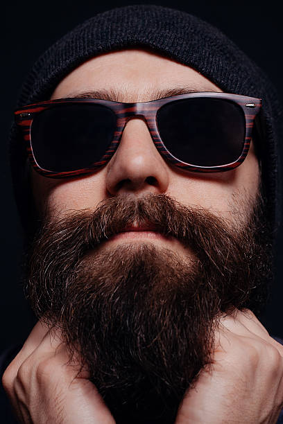 istock Handsome male big beard in glasses and hat 512123714