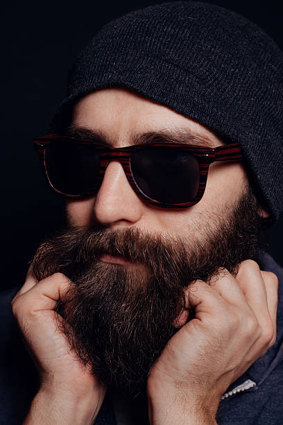 istock Handsome male big beard in glasses and hat 512123850