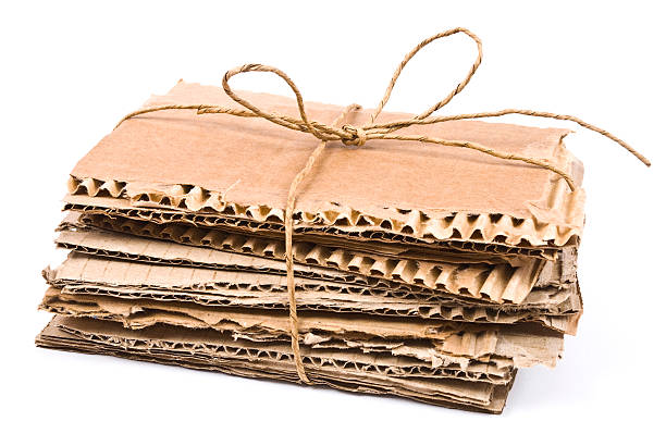 istock The pile of cardboard with rope and bow 512124228