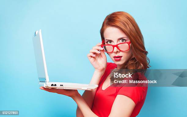 Redhead Girl With Laptop On Blue Background Stock Photo - Download Image Now - Adult, Adults Only, Beautiful People
