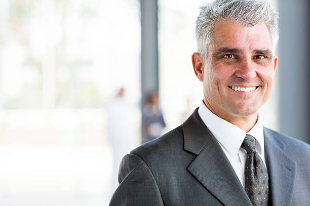 istock happy senior business man 512127963