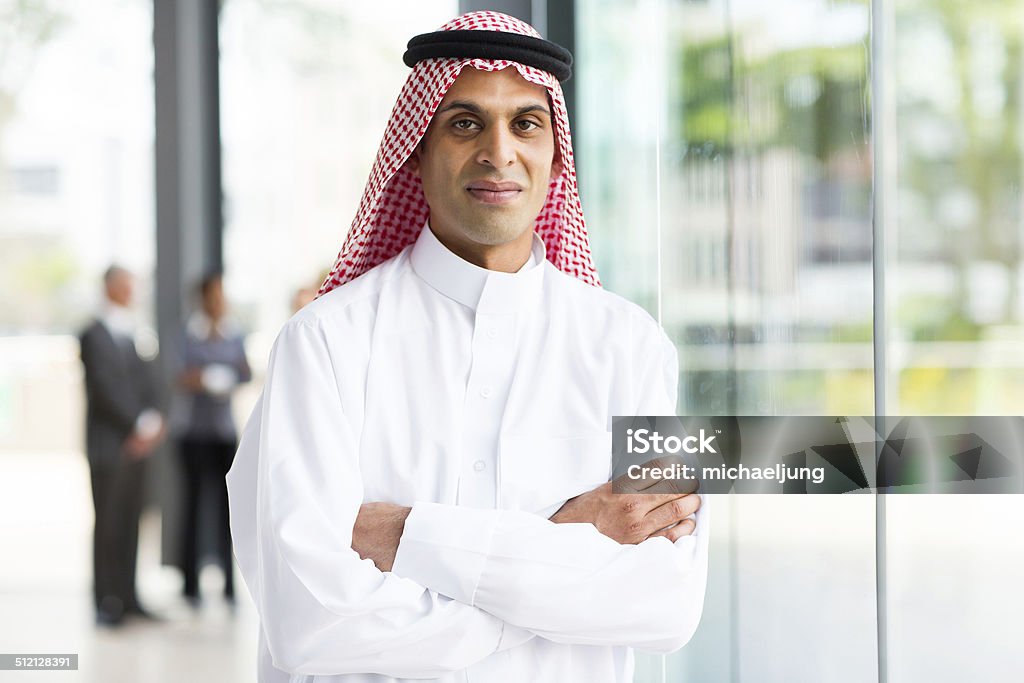 muslim businessman with arms crossed portrait of muslim businessman with arms crossed Saudi Arabia Stock Photo