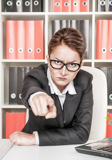 Angry woman boss pointing out