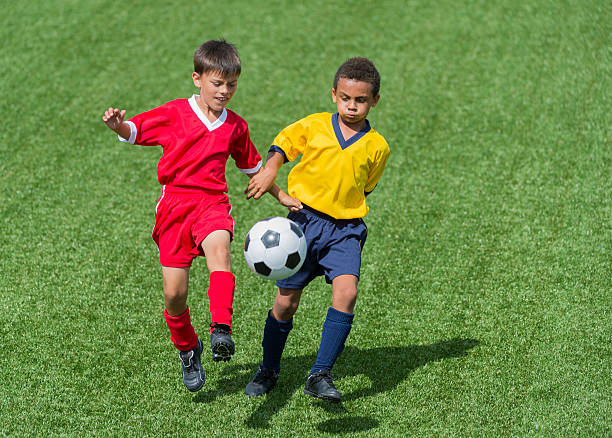 istock Two Young Soccer Players In Action 512132307