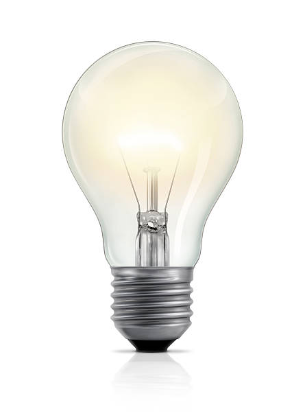 Glowing Light Bulb A light bulb with glowing filament, isolated on white background. Vertical version. light bulb filament photos stock pictures, royalty-free photos & images