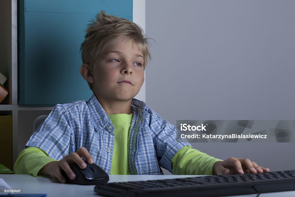 Computer Use For Boy Boy Using Computer At Night Stock Photo - Download Image Now ...