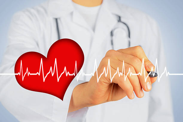 istock Doctor writes with pen shape of heartbeat 512133343