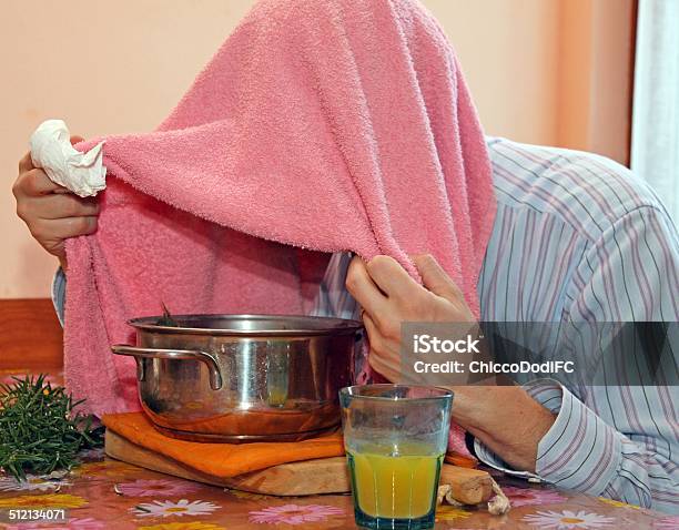 Man With Towel Breathe Balsam Vapors To Treat Colds Stock Photo - Download Image Now