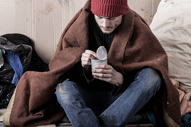 istock The poor man eating on the street 512135111
