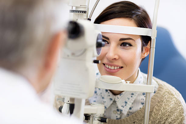istock Woman look in ophthalmoscope 512141978