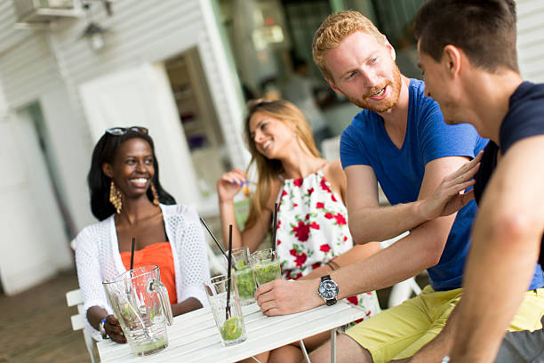 istock Young multiracial friends at cafe 512142046