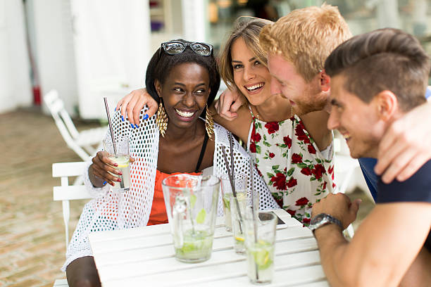 istock Young multiracial friends at cafe 512142156