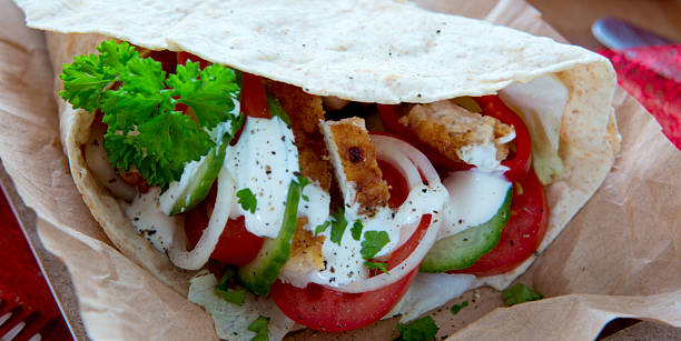 istock Tortilla wrap with chicken breast and vegetables. 512142468