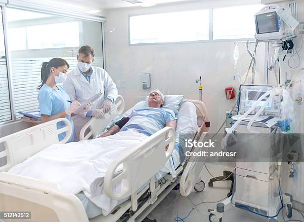 Doctors Working At The Hospital Stock Photo - Download Image Now - Intensive Care Unit, Emergency Room, Patient