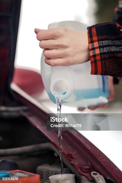 Pouring Antifreeze Washer Fluid Into Windshield Washer Tank Stock Photo - Download Image Now