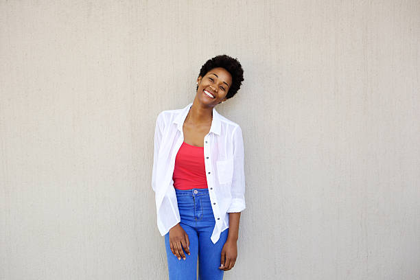 istock Attractive young woman standing against a wall 512143774