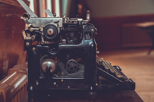istock Vintage Typewriter On An Old School Desk 512145060