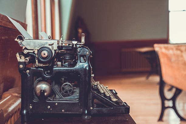 istock Vintage Typewriter On An Old School Desk 512145086
