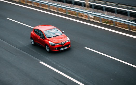 Izmir, Turkey - February 19, 2016 : The Renault Clio model driving on the highway in Izmir. Panned photography, high speed, motion blur