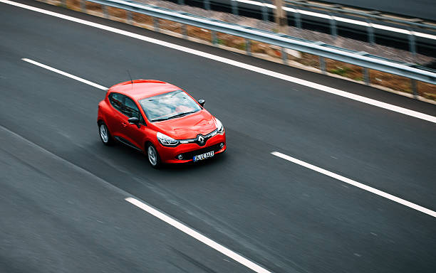 Renault Clio Izmir, Turkey - February 19, 2016 : The Renault Clio model driving on the highway in Izmir. Panned photography, high speed, motion blur vehicle accessory stock pictures, royalty-free photos & images
