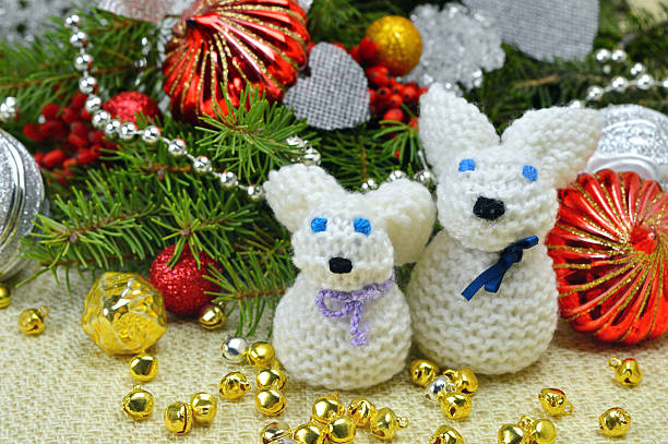 istock Christmas tree and knitted hare funny, in a rustic style. 512145282