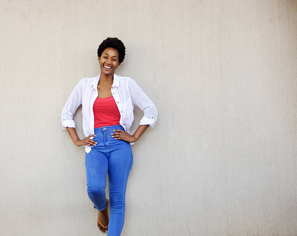 istock Young african woman standing with her hands on hips 512145782