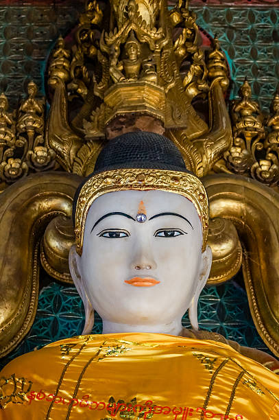 istock beautiful Buddha Portrait with prominent 3rd eye and orange lips 512145792