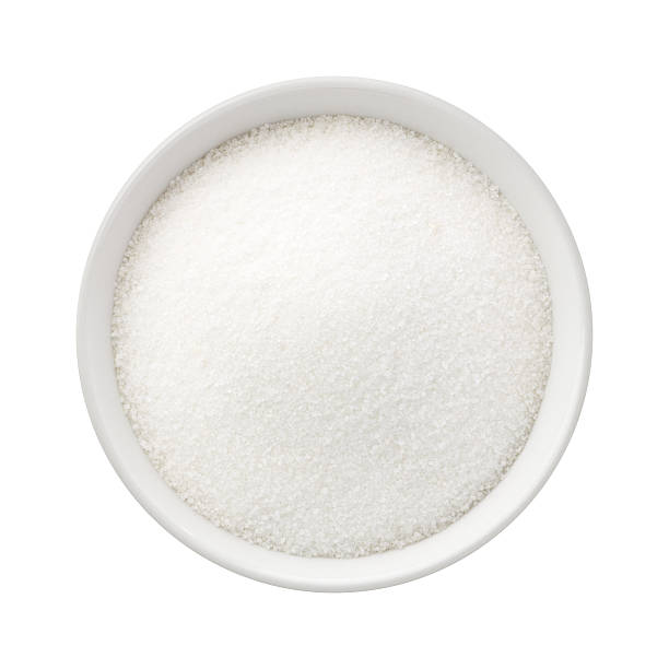 Refined Sugar in a Ceramic Bowl Refined Sugar in a Ceramic Bowl. The image is a cut out, isolated on a white background, with a clipping path. sugar stock pictures, royalty-free photos & images