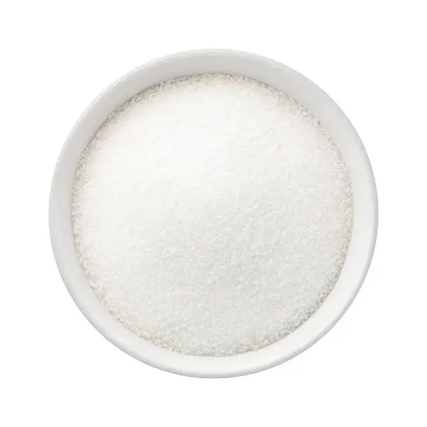 Refined Sugar in a Ceramic Bowl. The image is a cut out, isolated on a white background, with a clipping path.