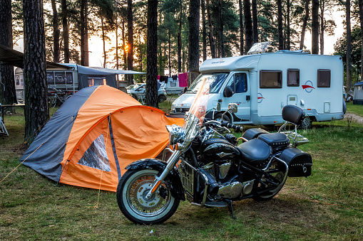 Augustów, Poland - August 12, 2015:Morning view of custom black motorcycle stand at the campsite, Augustów, Poland