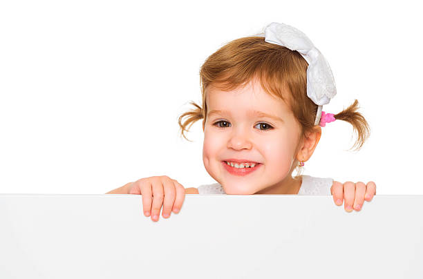 istock concept child girl with white blank poster isolated 512146900
