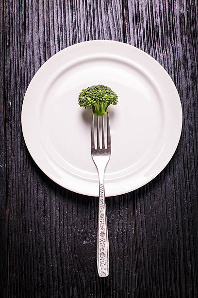 istock Bunch of fresh green broccoli on  wooden background 512147782