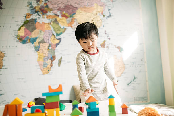 istock Toddler playing with toys 512148610