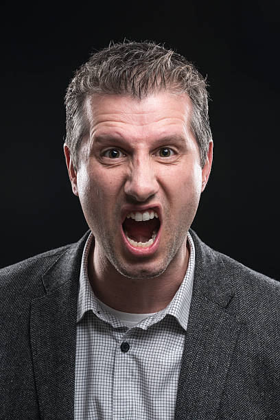istock attractive angry businessman portrait shouting at camera 512150018