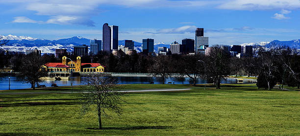 Downtown Denver with Rocky Mountains from City Park stock photo