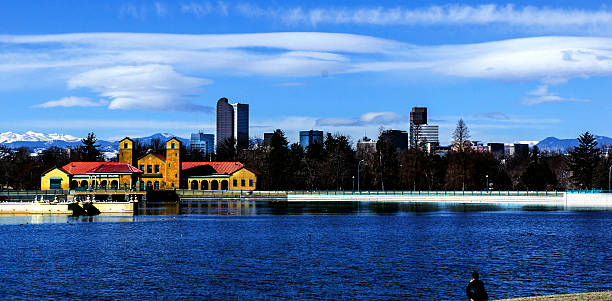 Downtown Denver with Rocky Mountains from City Park stock photo