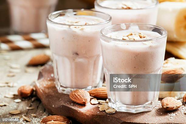 Smoothie With Banana Yogurt Oatmeal And Nuts Stock Photo - Download Image Now - Almond, Smoothie, Banana