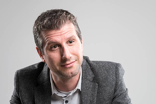 istock attractive businessman portrait looking happy at camera 512150578