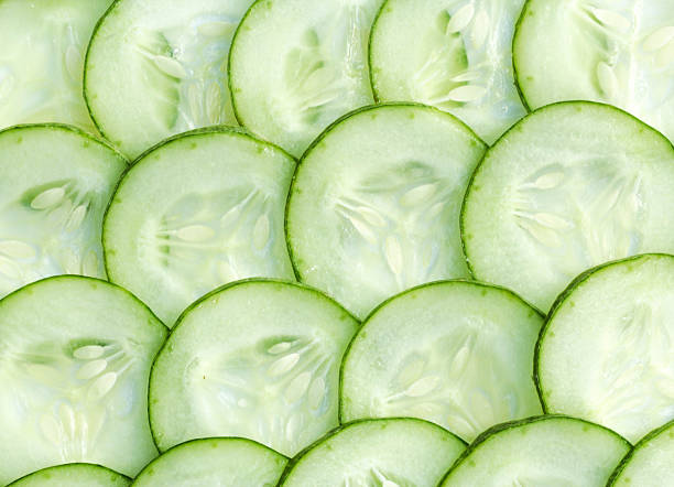 istock Fresh Cucumber and slices background 512152085