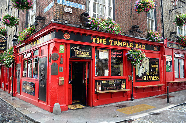 Famous Temple Bar in Dublin Dublin, Ireland - June 16, 2012: Famous red pub in the Temple Bar district in Dublin, Ireland on June 16, 2012. guinness photos stock pictures, royalty-free photos & images