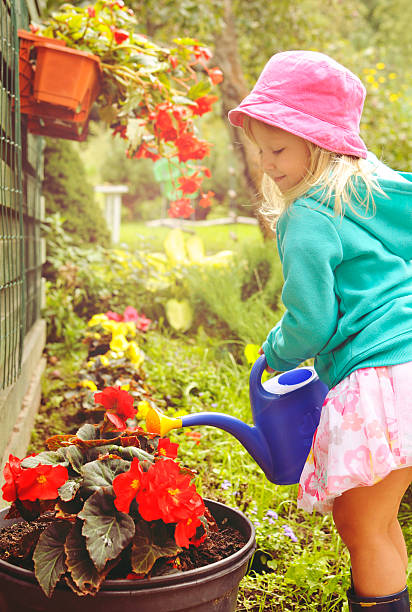 istock Little girl gardening. 512152477