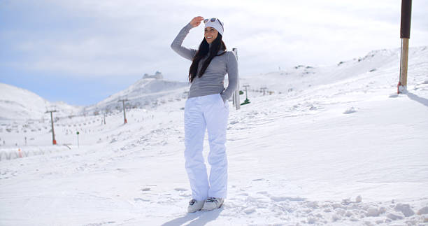 istock Attractive young woman standing in winter snow 512152778