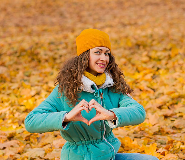 istock hands in heart shape outdoors 512154028
