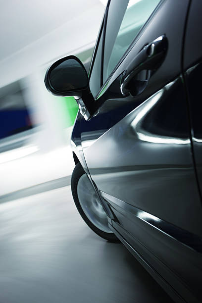 istock black car speednig at underground garage 512154225