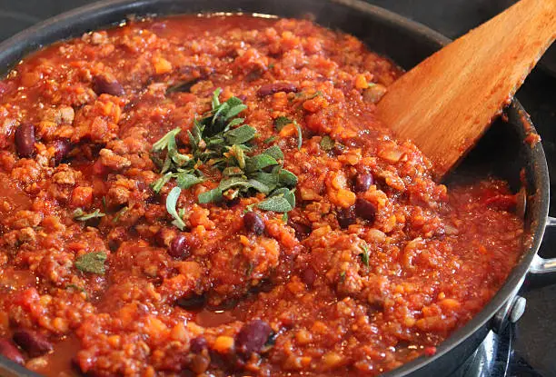 Photo of Image of healthy vegetarian chili con carne cooking, frying pan