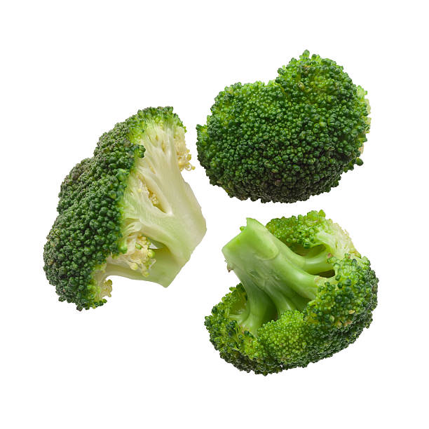 Cooked broccoli isolated Cooked broccoli isolated on white background steamed stock pictures, royalty-free photos & images