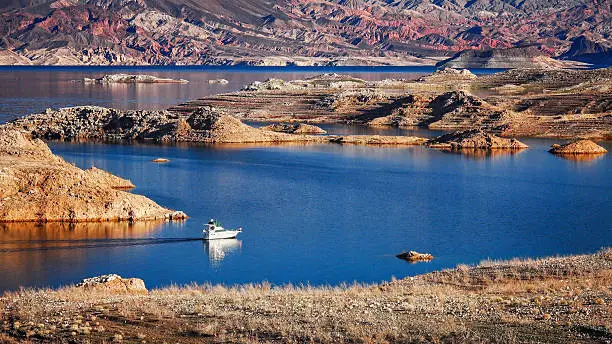 A boat enters a narrow channel on Lake Mead